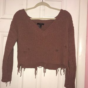 Knit sweater with distressed holes